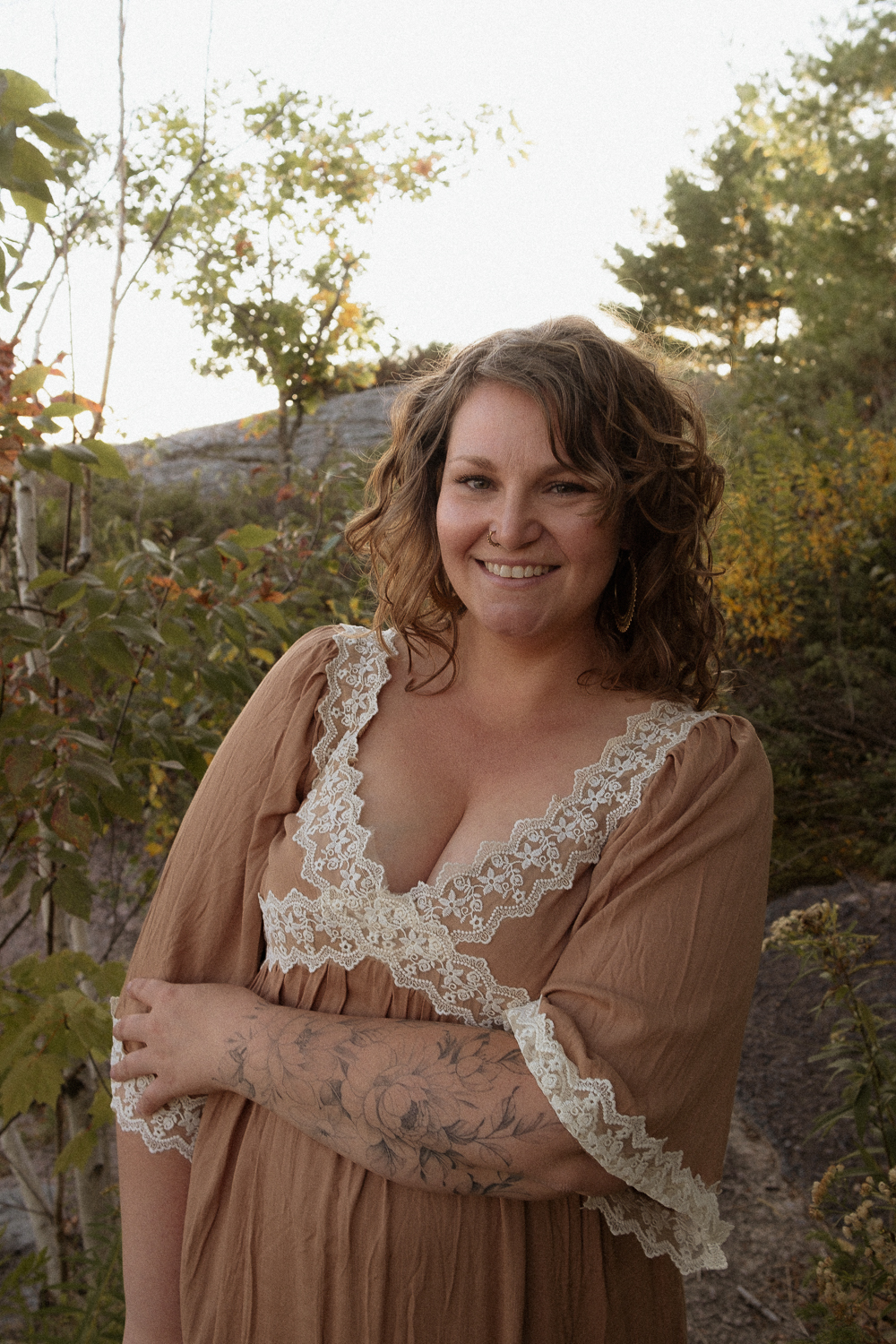 wedding photographer engages with nature outside for her brand photos