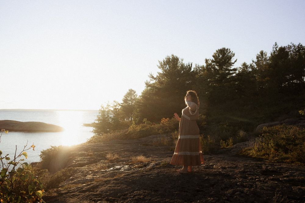 wedding photographer engages with nature outside for her brand photos