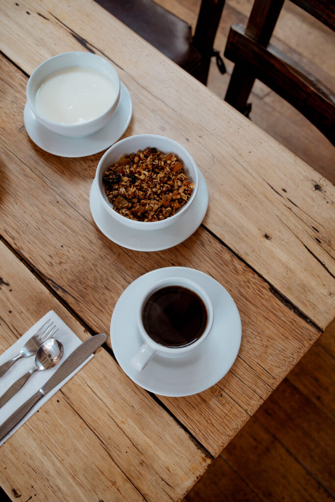 Tea, coffee, and granola on a table