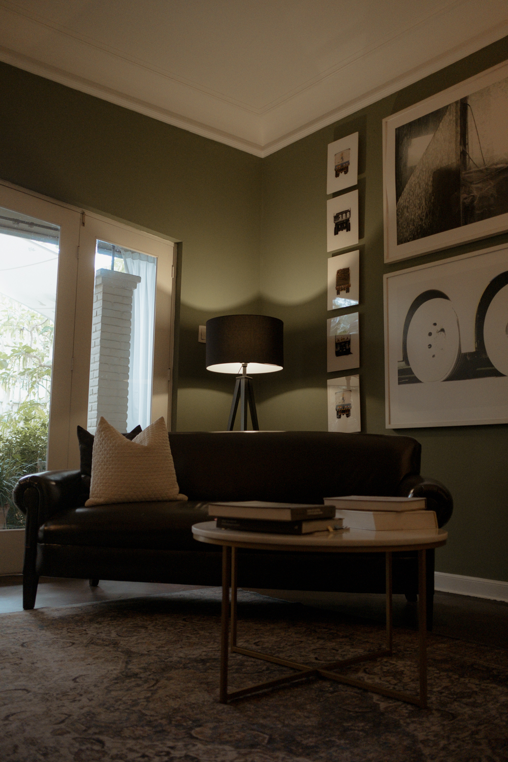 Art room with couch and paintings on the wall